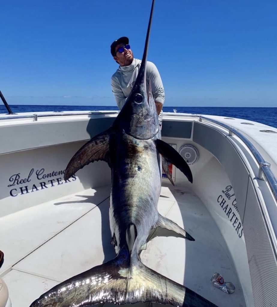 A prized Swordfish catch after a fishing charter captured the exhilaration and achievement of their deep-sea fishing trip.