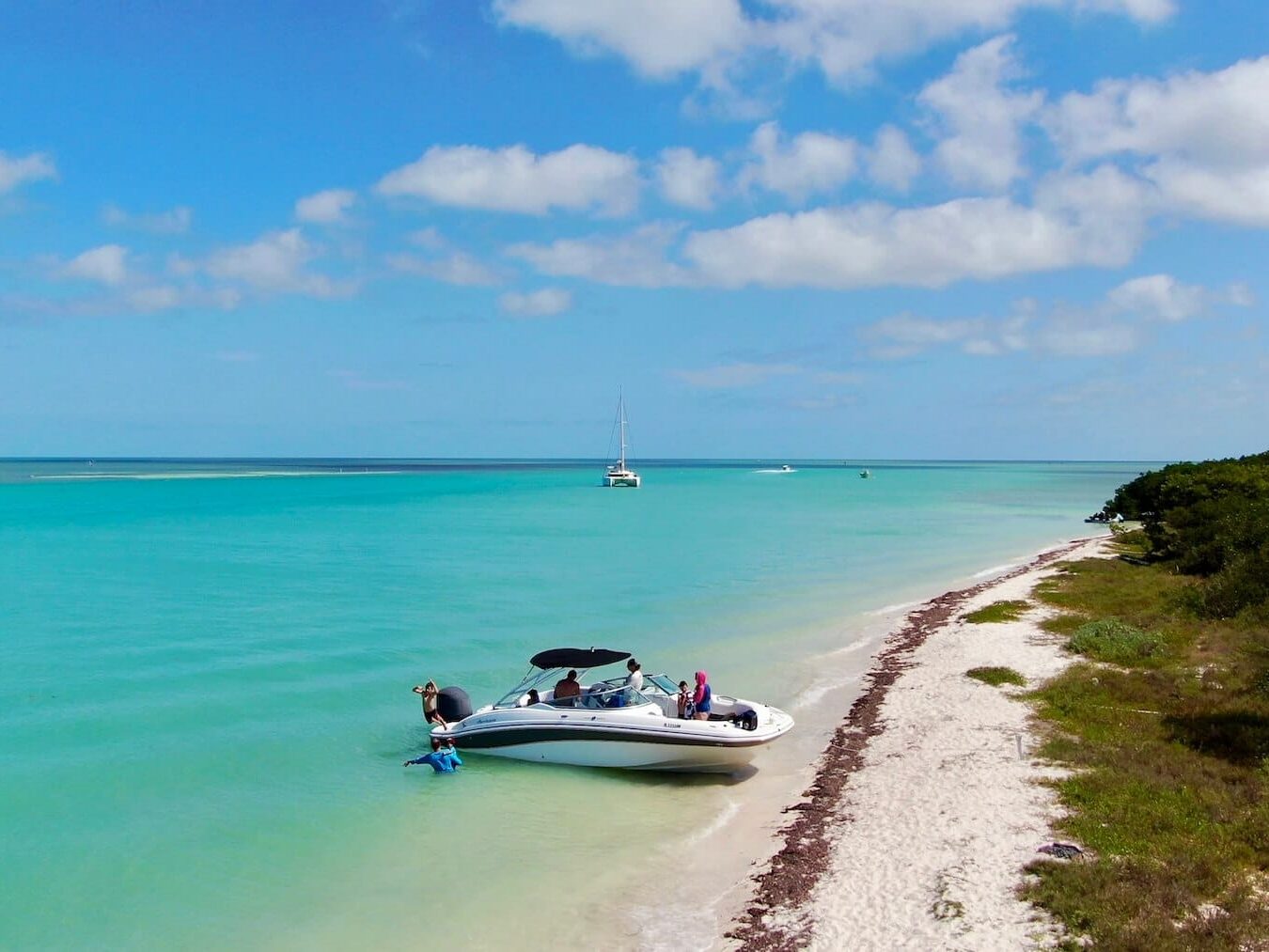 Scenic view of a beautiful charter boat moored on a sandbar in the Florida Keys during a sandbar charter.