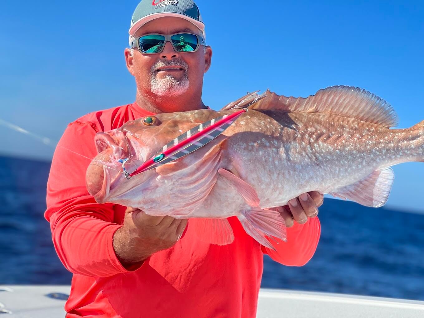 man holding red grouper during fantastic charter in key west