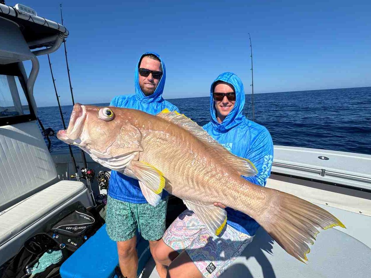 two men holding big fish during fishing charter at the Dry Tortugas