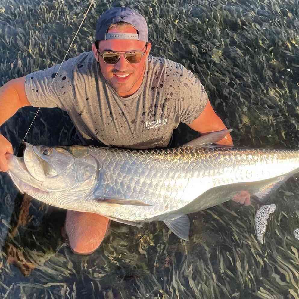 Captain with large tarpon in Key Largo, Florida.