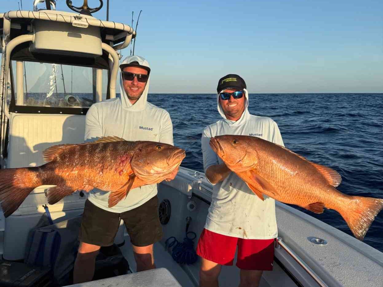 big pine key fishing charter cubera snapper e1749226660951 Reel Guides Two fishermen display a pair of large Cubera snappers aboard a boat booked through Big Pine Key fishing charters.