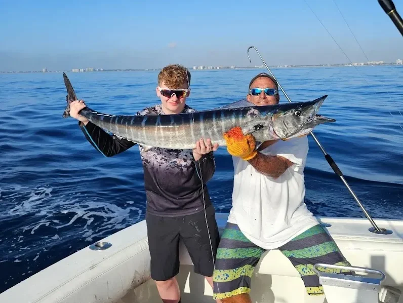 ono fish happy customers e1775774338616 Reel Guides Happy customers posing with freshly caught ono fish