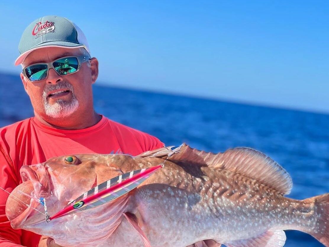 second gen keywest charter catch Reel Guides Angler holding a large red grouper caught with Second Generation Charters – one of the best fishing guides in Key West.